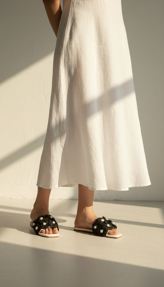 Gili Flats Black & White worn by model – women's floral slip-on flats
