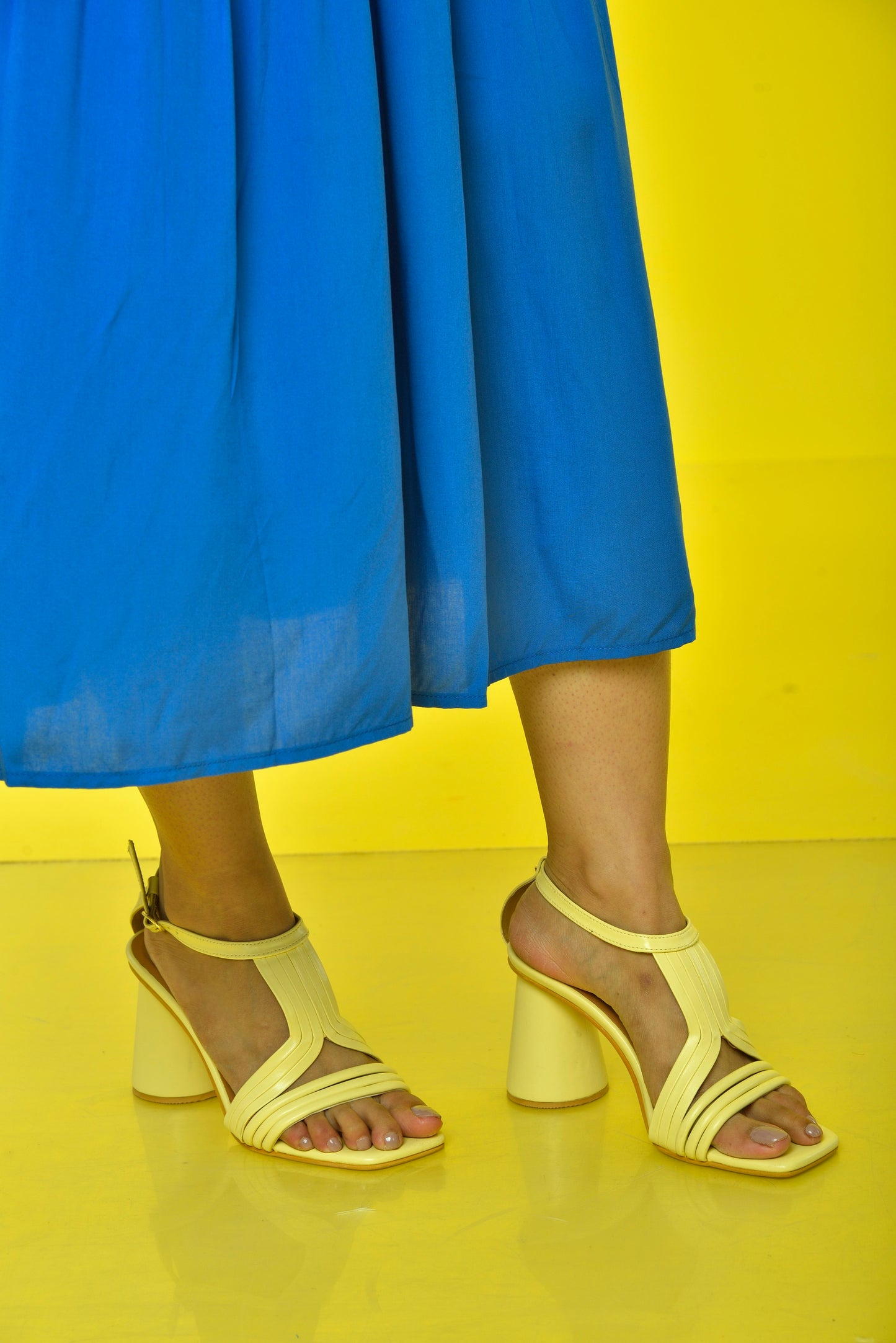 Pina Colada Heels Sunlit Yellow worn by model – women's yellow statement cylindrical heels
