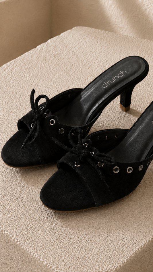 Black Suede Bow Kitten Heels for Women – Close Up of Bow & Metallic Eyelet Detail | Drunch