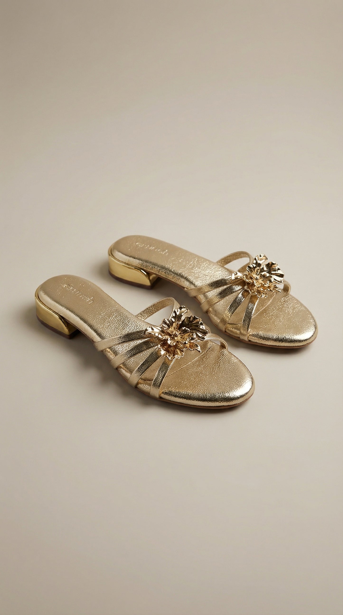 Everglow Flat Sandals in Gold – Top Right Angle View of Floral Buckle Flats for Women | Drunch