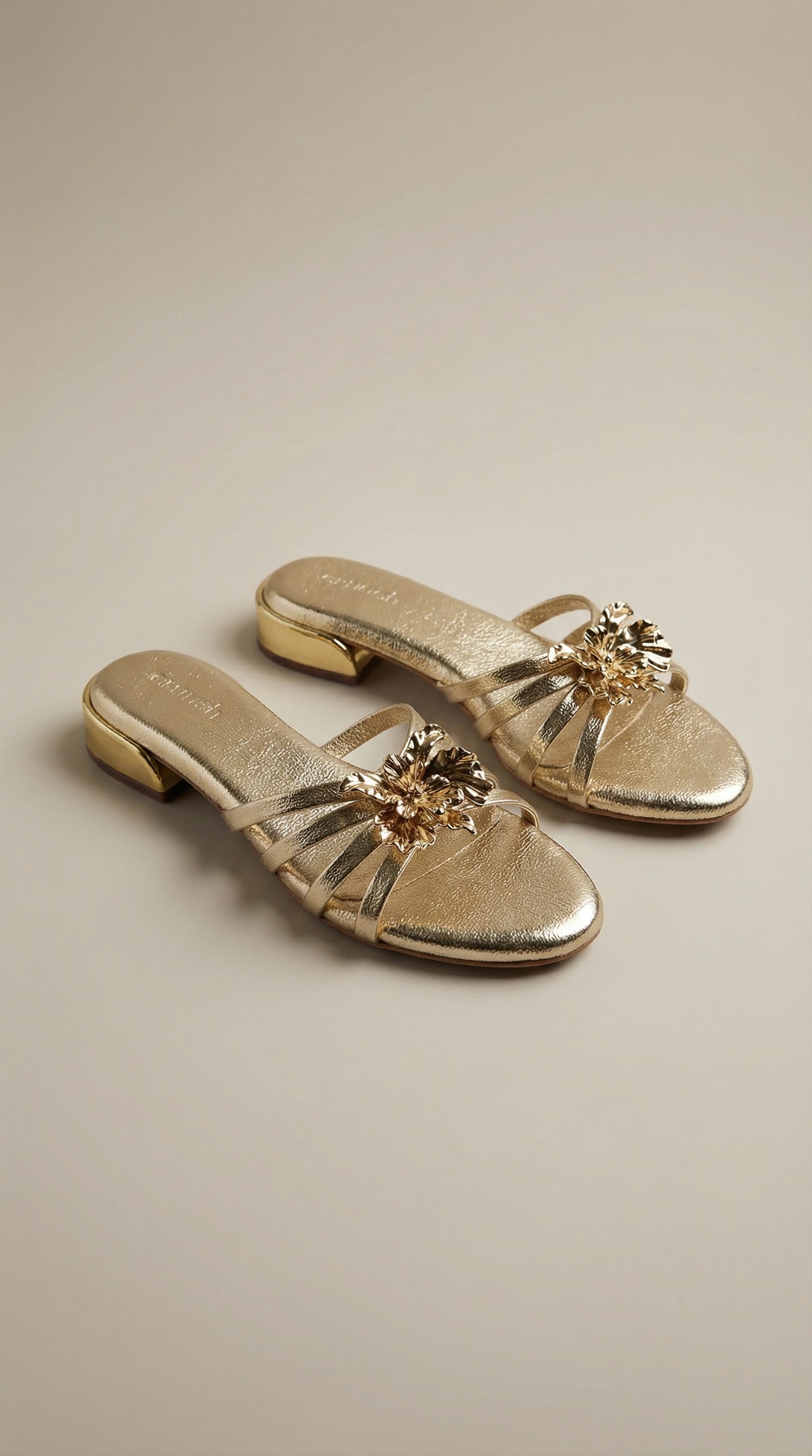 Everglow Flat Sandals in Gold – Top Right Angle View of Floral Buckle Flats for Women | Drunch