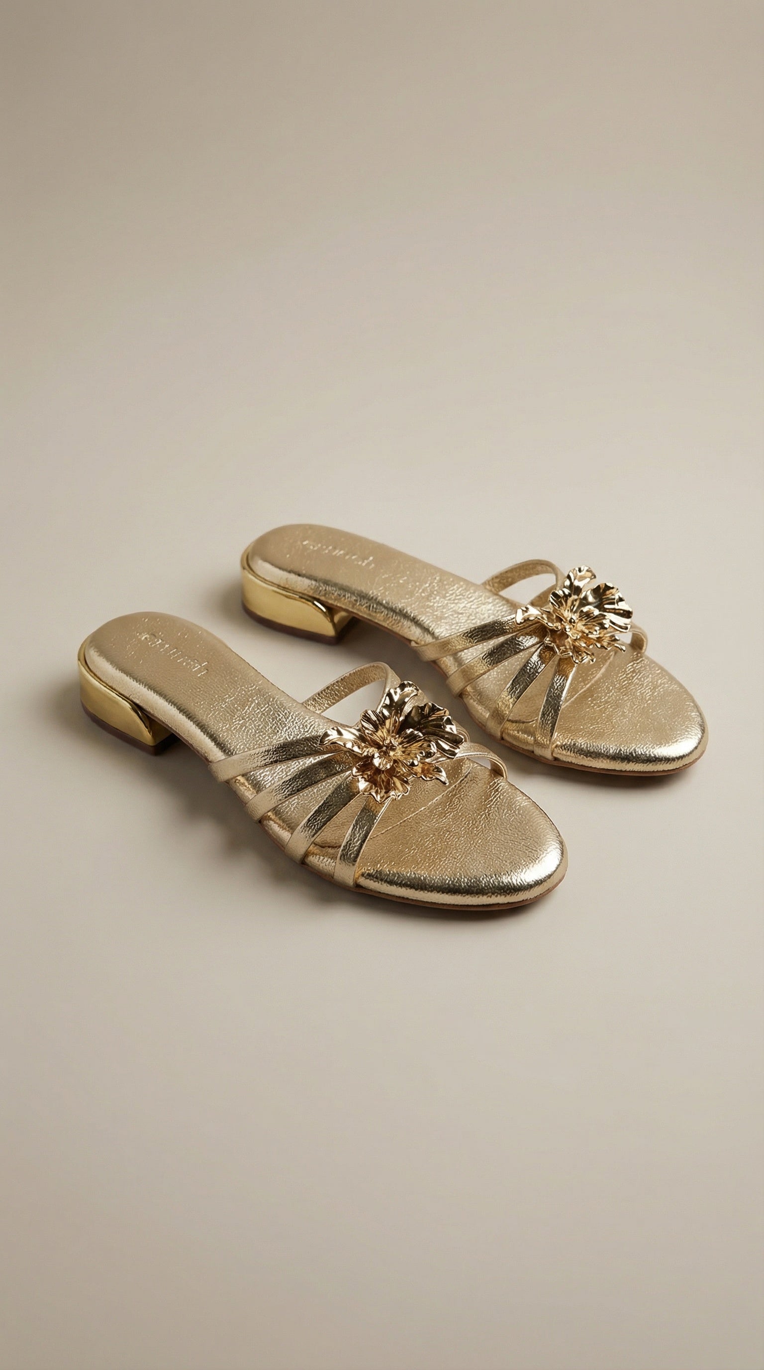 Everglow Flat Sandals in Gold – Top Right Angle View of Floral Buckle Flats for Women | Drunch