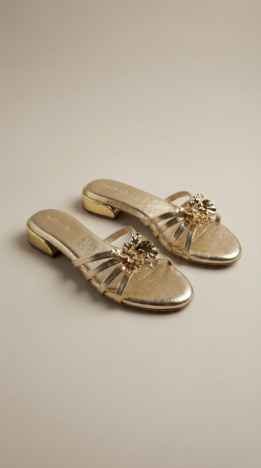 Everglow Flat Sandals in Gold – Top Right Angle View of Floral Buckle Flats for Women | Drunch
