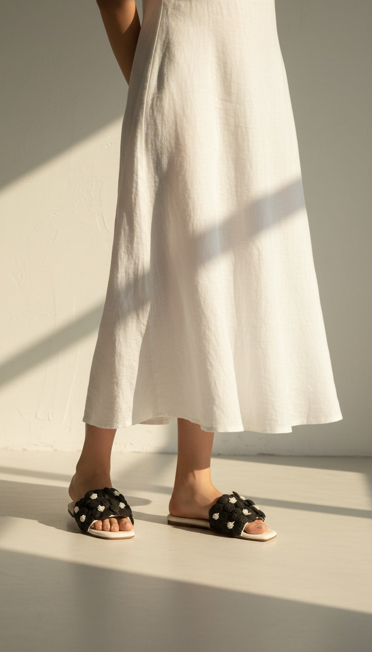 Gili Flats Black & White worn by model – women's floral slip-on flats