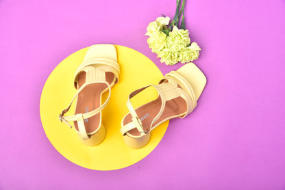 Pina Colada Heels Sunlit Yellow – angled view, minimalist strap yellow cylindrical heels